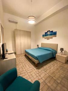 Giường trong phòng chung tại Naxos Apartments