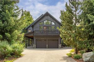 a house with a balcony and a garage at 8166 Nicklaus North in Whistler
