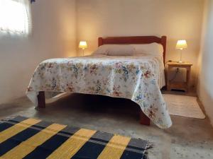 Cama ou camas em um quarto em Chalé na Montanha