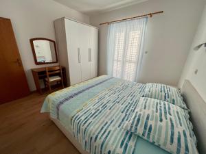 Postel nebo postele na pokoji v ubytování Apartments Villa Emilija