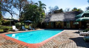 The swimming pool at or close to Sunbird Lodge