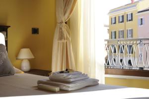 Posteľ alebo postele v izbe v ubytovaní Piazza Azuni 18 Guest House