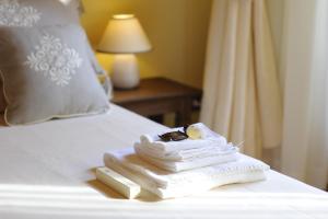 Posteľ alebo postele v izbe v ubytovaní Piazza Azuni 18 Guest House