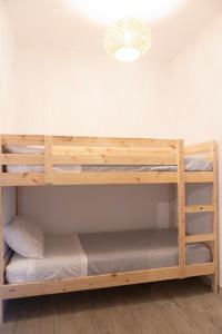 a bunk bed room with two bunk beds in it at MrBrown - Cinzia Resort Beach in Mazara del Vallo