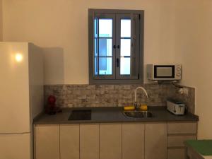 Kuchyňa alebo kuchynka v ubytovaní Apartamentos Casa la Costanilla + 37 fotografií