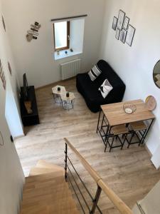 Posezení v ubytování Appartement au cœur d'Espalion La Cabane du Lot