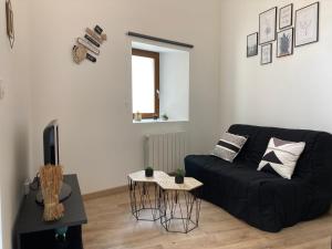 Posezení v ubytování Appartement au cœur d'Espalion La Cabane du Lot