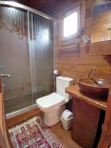 a bathroom with a toilet and a sink at DefneWoodHome in Bodrum City