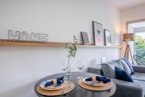 a living room with a table and a couch at Trend Nova Carlos Gomes - 406 in Porto Alegre