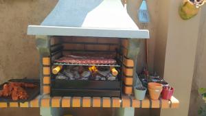 a toy oven with food inside of it at La Casucha junto al mar in Vilagarcia de Arousa