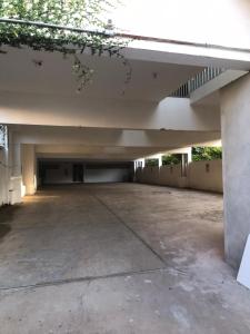 an empty parking lot in a parking garage at HOTEL BELA VISTA NOVA ODESSA in Nova Odessa