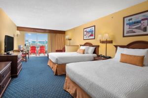 a hotel room with two beds and a television at Bonita Beach Hotel in Ocean City +20 photos