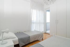 Postel nebo postele na pokoji v ubytování Apartment Vlahov