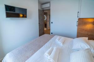 Posteľ alebo postele v izbe v ubytovaní PINNA RESIDENCE - Caretta