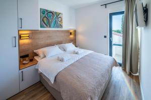 Posteľ alebo postele v izbe v ubytovaní PINNA RESIDENCE - Caretta + 37 fotografií