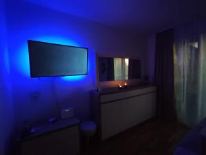 TV o dispositivi per l'intrattenimento presso Sky Way Studio Apartment