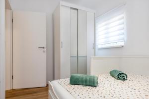 Postel nebo postele na pokoji v ubytování Apartment Oli
