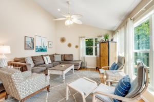 a living room with a couch and chairs at Compass Rose II in Folly Beach
