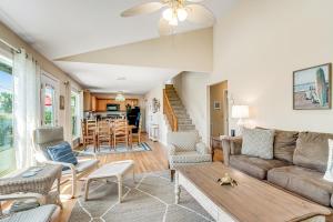 a living room with a couch and a table at Compass Rose II in Folly Beach