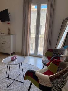 TV a/nebo společenská místnost v ubytování Nenetta Rooms & Suites Monopoli