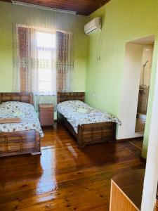 Voodi või voodid majutusasutuse Guesthouse Kamelia toas