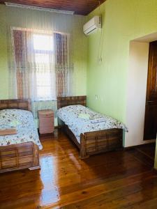 Voodi või voodid majutusasutuse Guesthouse Kamelia toas