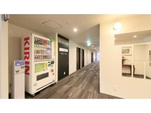 an empty hallway in a hospital with a refrigerator at HOTEL COONEL INN - Vacation STAY 33516v in Susono