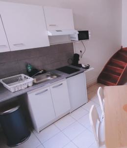 Kuchyňa alebo kuchynka v ubytovaní Appartement Cosy en centre centre-ville . . .