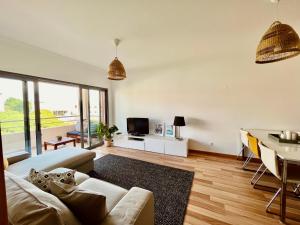 a living room with a couch and a table at My Place in Portimão