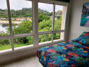 Ein Bett oder Betten in einem Zimmer der Unterkunft Apartamento Vistas Pedrido