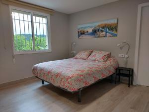 Ein Bett oder Betten in einem Zimmer der Unterkunft Apartamento Vistas Pedrido