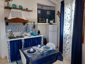 Kuchyň nebo kuchyňský kout v ubytování Holiday Room Sa Tebia