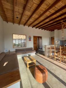 a living room with a couch and a table at Villas turrutela in Los Órganos