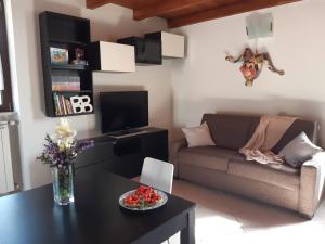 a living room with a couch and a table at Il Rifugio di Farinella in Putignano +21 photos