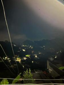 a view of a city lit up at night at Serenity House in Baguio