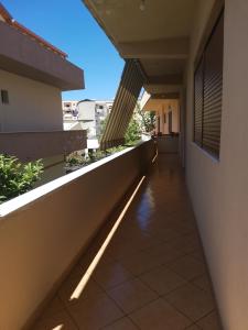 a hallway of a building with a light on the floor at House in Vlorë