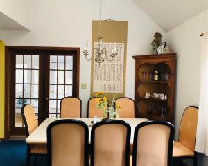 a dining room with a table and chairs at My Little Flagship Cabin in East Stroudsburg