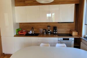 Kuchyňa alebo kuchynka v ubytovaní Apartament Comfort Del Mar IV Kolobrzeg