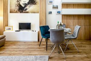 TV a/nebo společenská místnost v ubytování Bellini Apartment