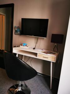 TV a/nebo společenská místnost v ubytování Dithmarscher Haus