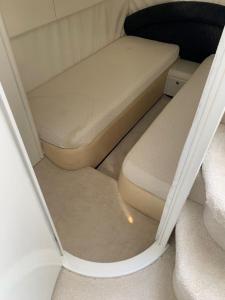 a small bed in the back of a boat at Yacht 17M Cannes Croisette Port Canto,3 Ch,clim,tv in Cannes