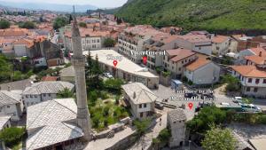 an aerial view of a town with a clock tower at Apartment Elite Residence in Mostar