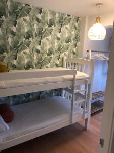 Posteľ alebo postele v izbe v ubytovaní MILLADOIRO BELLA BOUTIQUE