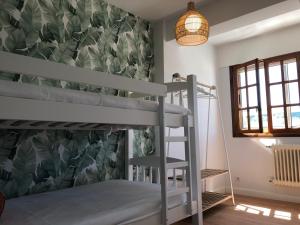 Posteľ alebo postele v izbe v ubytovaní MILLADOIRO BELLA BOUTIQUE