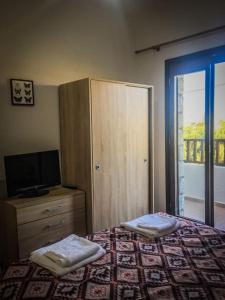 Katil atau katil-katil dalam bilik di Poseidon Castle Apartment