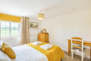 Katil atau katil-katil dalam bilik di Hillside Cottage