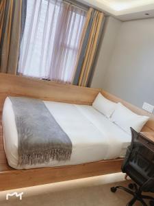 Ένα ή περισσότερα κρεβάτια σε δωμάτιο στο Madison LES Hotel