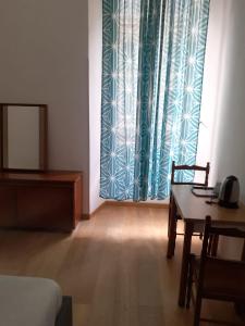 Postel nebo postele na pokoji v ubytování R.T. HOUSE'S