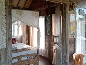 Postel nebo postele na pokoji v ubytování Ananda JJ Ubud Resort & Spa