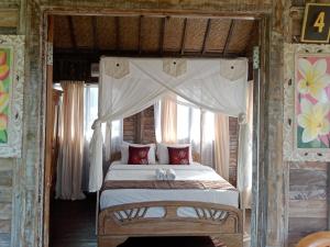 Postel nebo postele na pokoji v ubytování Ananda JJ Ubud Resort & Spa